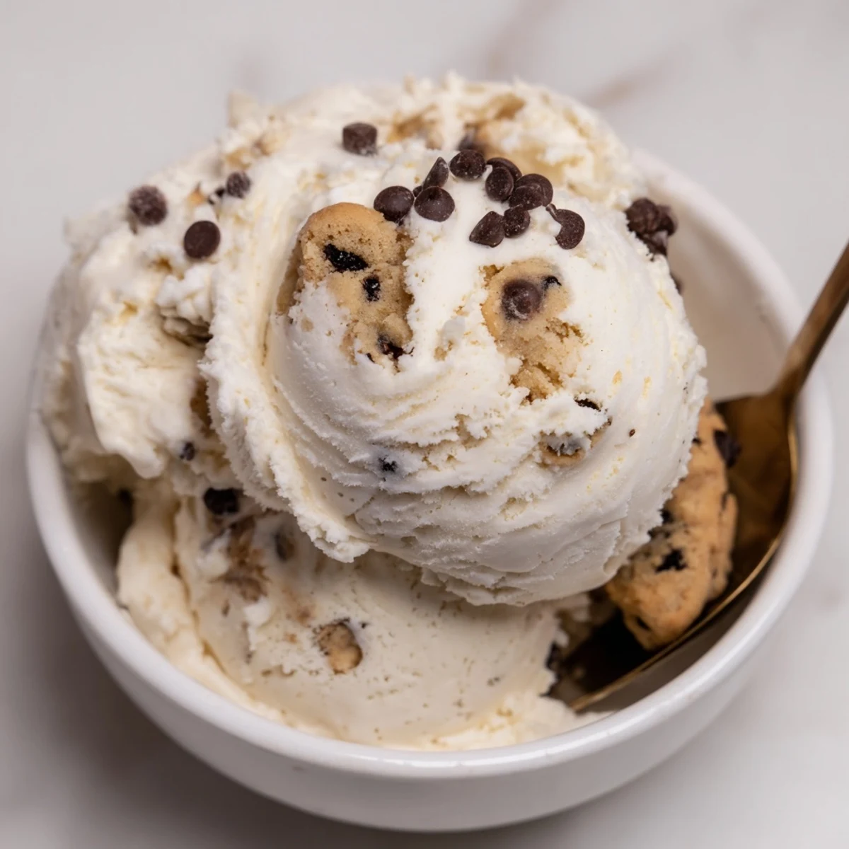 Creamy cottage cheese ice cream with cookie dough bites, perfect for summer treats.  