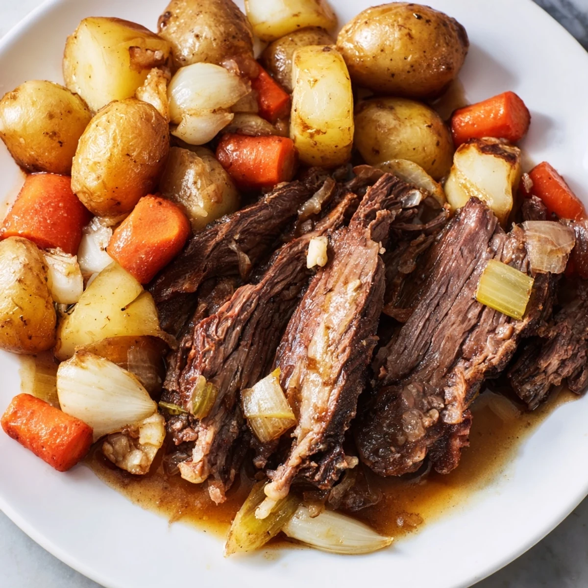 A steaming, flavorful bowl of Sunday Pot Roast, with delicious veggies and rich gravy, perfect for sharing.