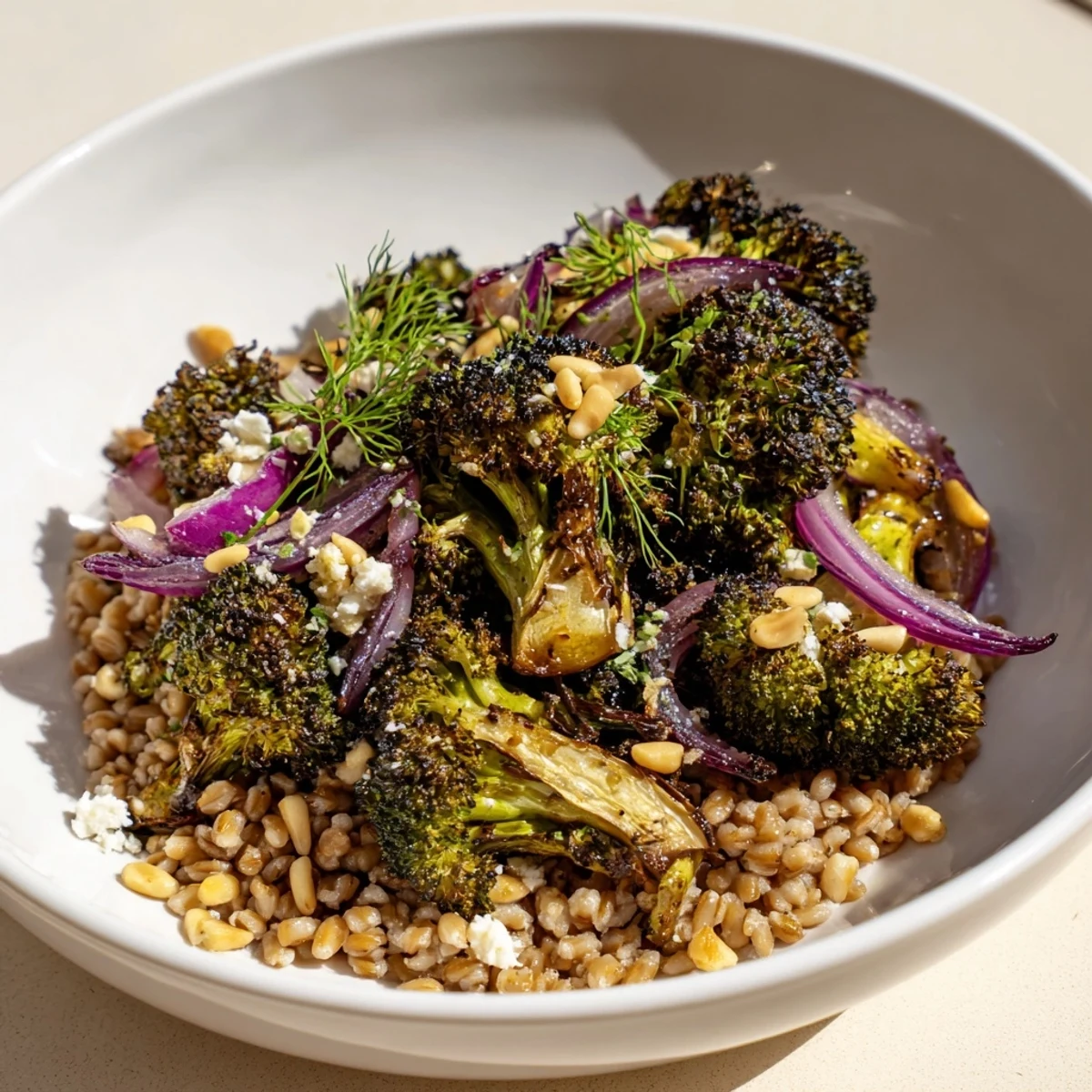 Close-up of the flavorful warm roasted broccoli and farro, a vegetarian delight with a zesty dressing.