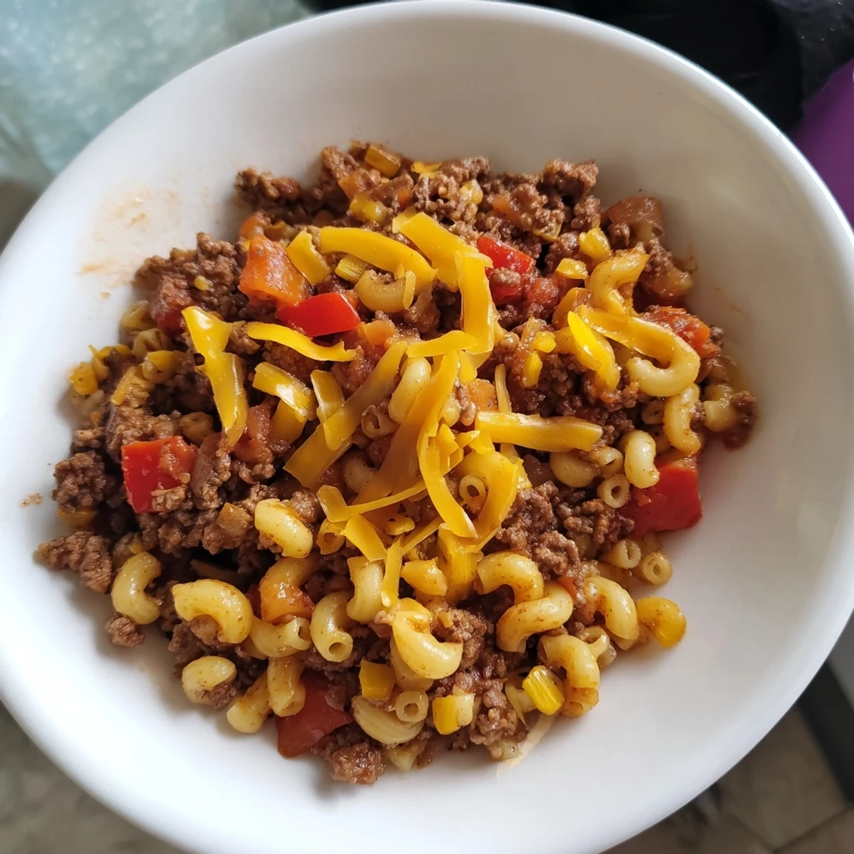 Golden, melted cheese blankets this delicious Cheeseburger Chili Mac skillet, a comforting supper.