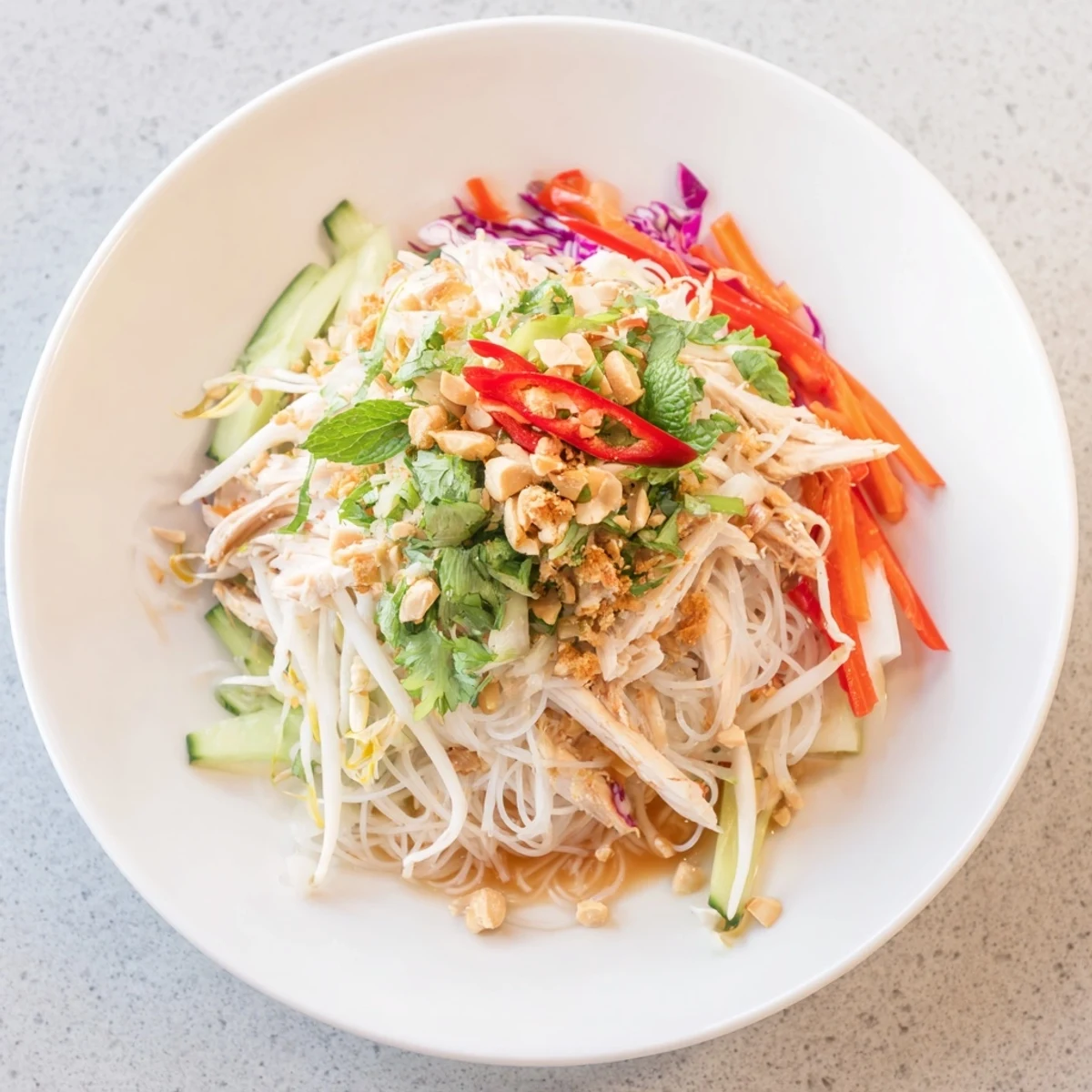 This delicious Vietnamese Crunch Noodle Salad with shredded chicken features colorful veggies and flavorful dressing.