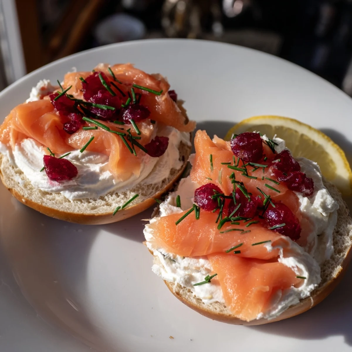 A vibrant close-up of a cranberry sleigh bagel board laden with creamy toppings and fresh fruit.