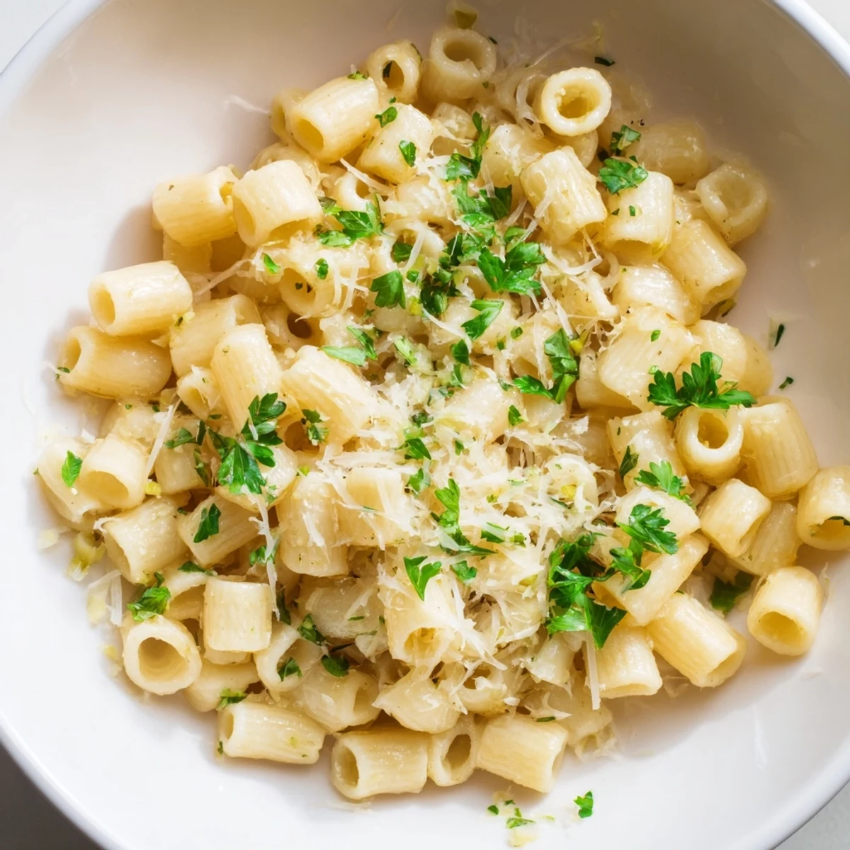 Close-up showing a steamy bowl of One-Pot Garlic Butter Ditalini pasta ready to serve.