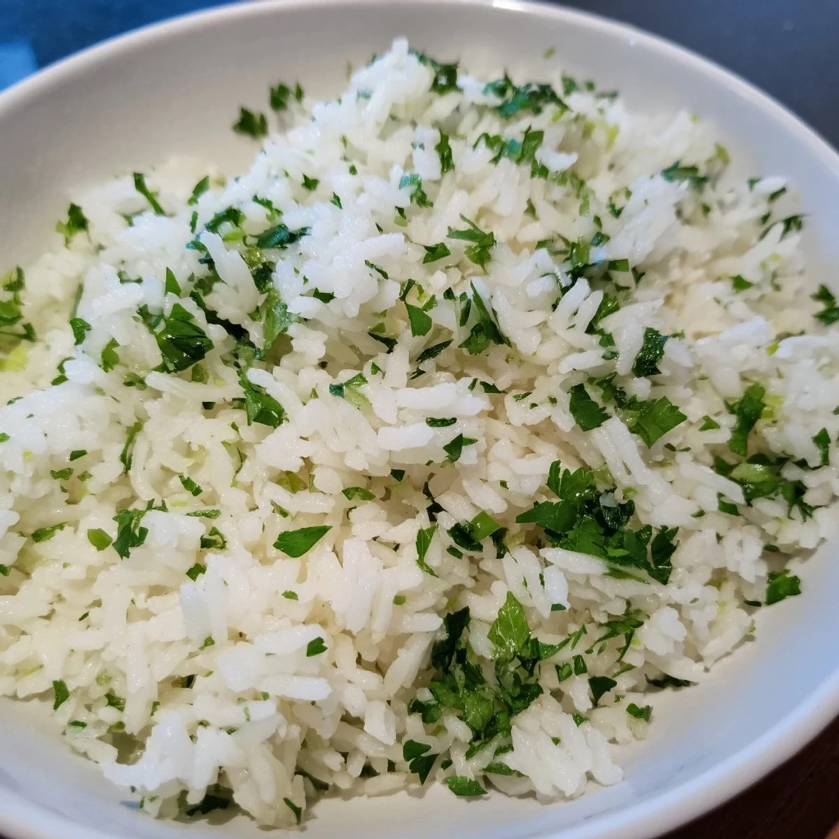 Steaming bowl of Cilantro Lime Rice, infused with zesty lime, ideal with grilled chicken or fish.