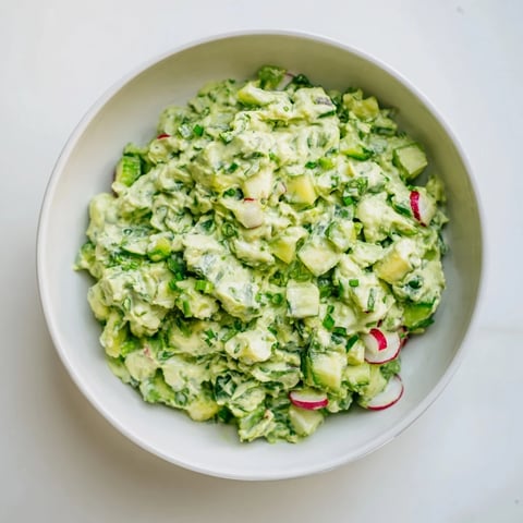 Creamy Green Goddess Cabbage Dip, a refreshing appetizer, with vibrant green vegetables ready to serve.