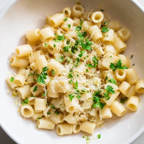 Close-up showing a steamy bowl of One-Pot Garlic Butter Ditalini pasta ready to serve.