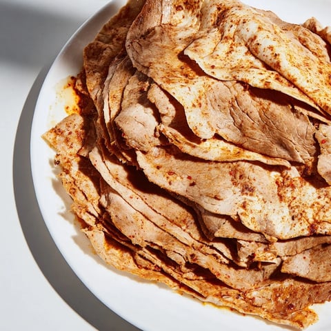 Savory Turkish Döner meat, thinly sliced and ready to be nestled in warm flatbreads with fresh toppings.