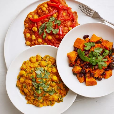 Comforting Thai red lentil curry topped with basil, featuring coconut milk and veggies.  