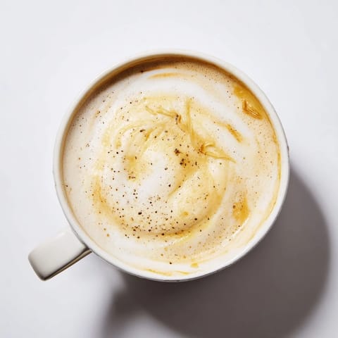Unconventional onion latte showcasing creamy textures and caramelized flavors in every sip.  