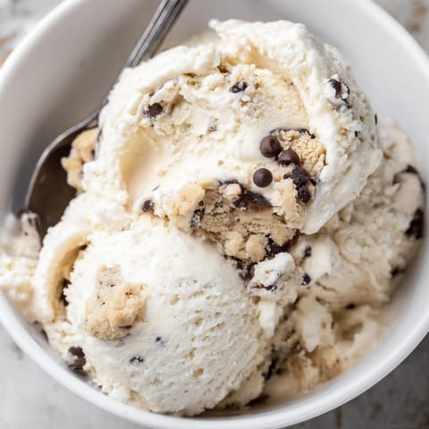 Indulge in this cottage cheese ice cream topped with rich cookie dough chunks.  