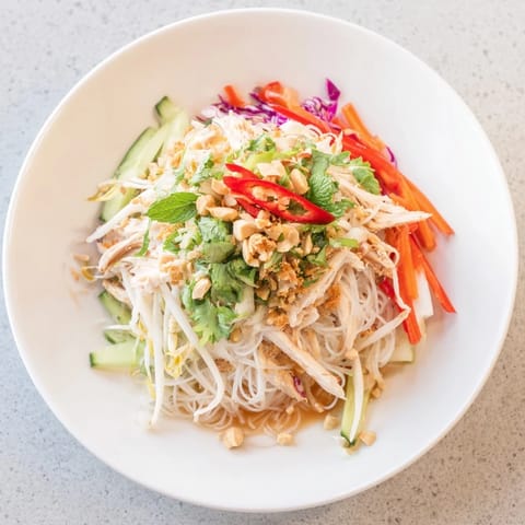 This delicious Vietnamese Crunch Noodle Salad with shredded chicken features colorful veggies and flavorful dressing.