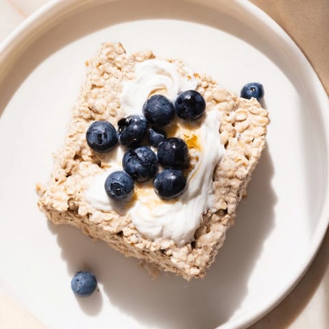 Warm, sliced Protein Pancake Oats with a drizzle of maple syrup—a delicious, high-protein breakfast idea.