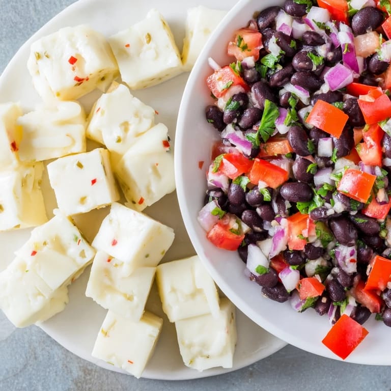 Appetizing photo of flavorful Pepper Jack bites served with colorful homemade black bean salsa.
