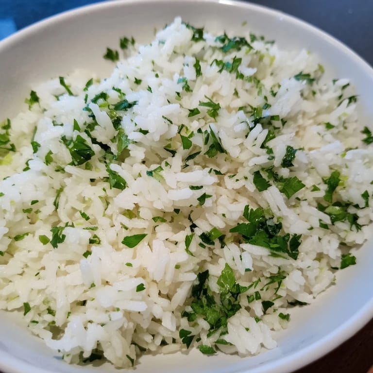 Steaming bowl of Cilantro Lime Rice, infused with zesty lime, ideal with grilled chicken or fish.