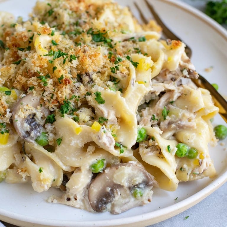 Creamy tuna noodle casserole with tender egg noodles, vegetables and a savory, bubbling sauce.