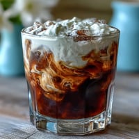 Cold brew coffee with vanilla sweet cream, a creamy, refreshing iced coffee dream.